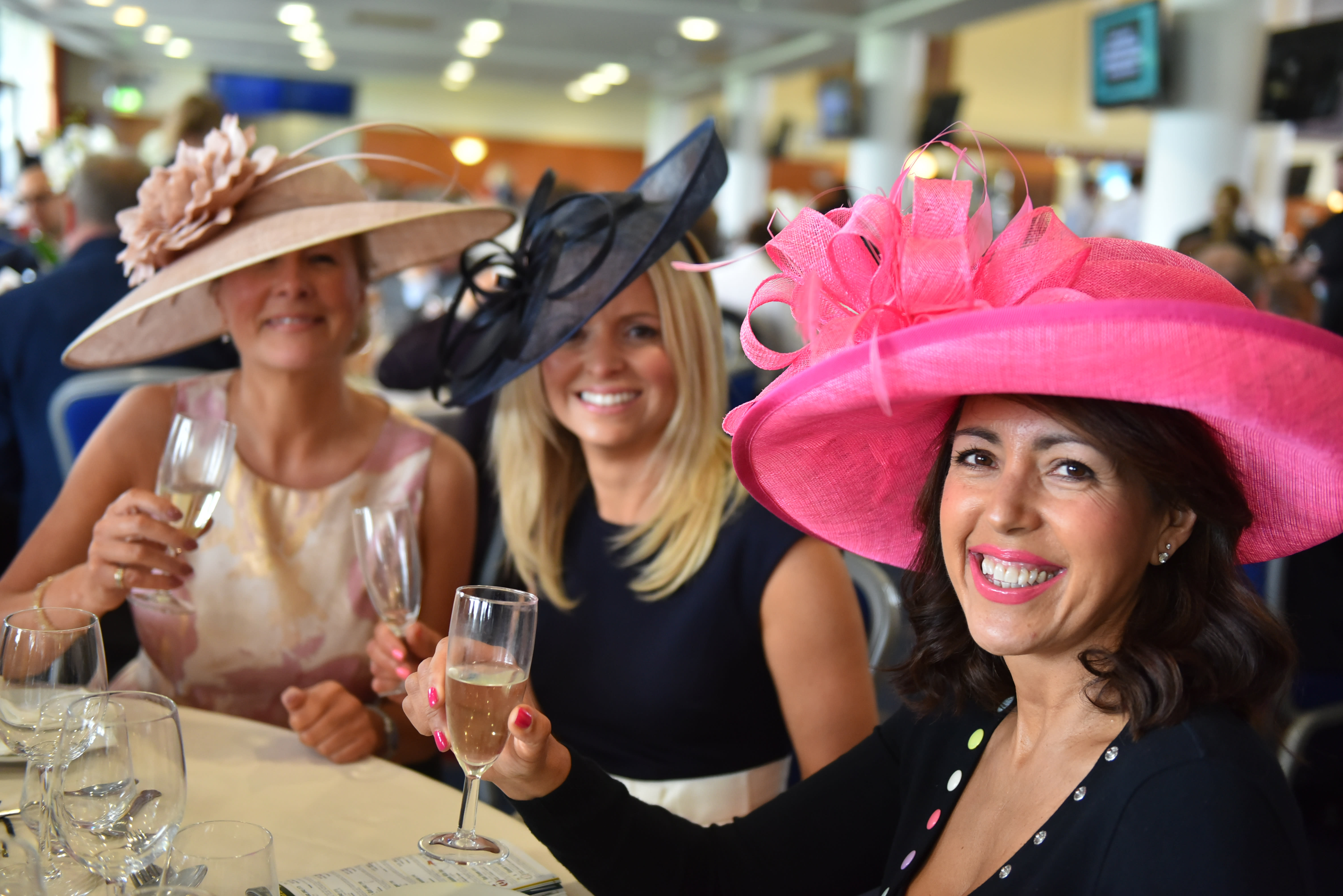 Three ladies enjoying a glass of champagne at York Racecourse