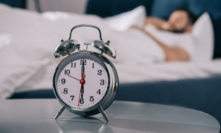 Alarm Clock on Bedside Table