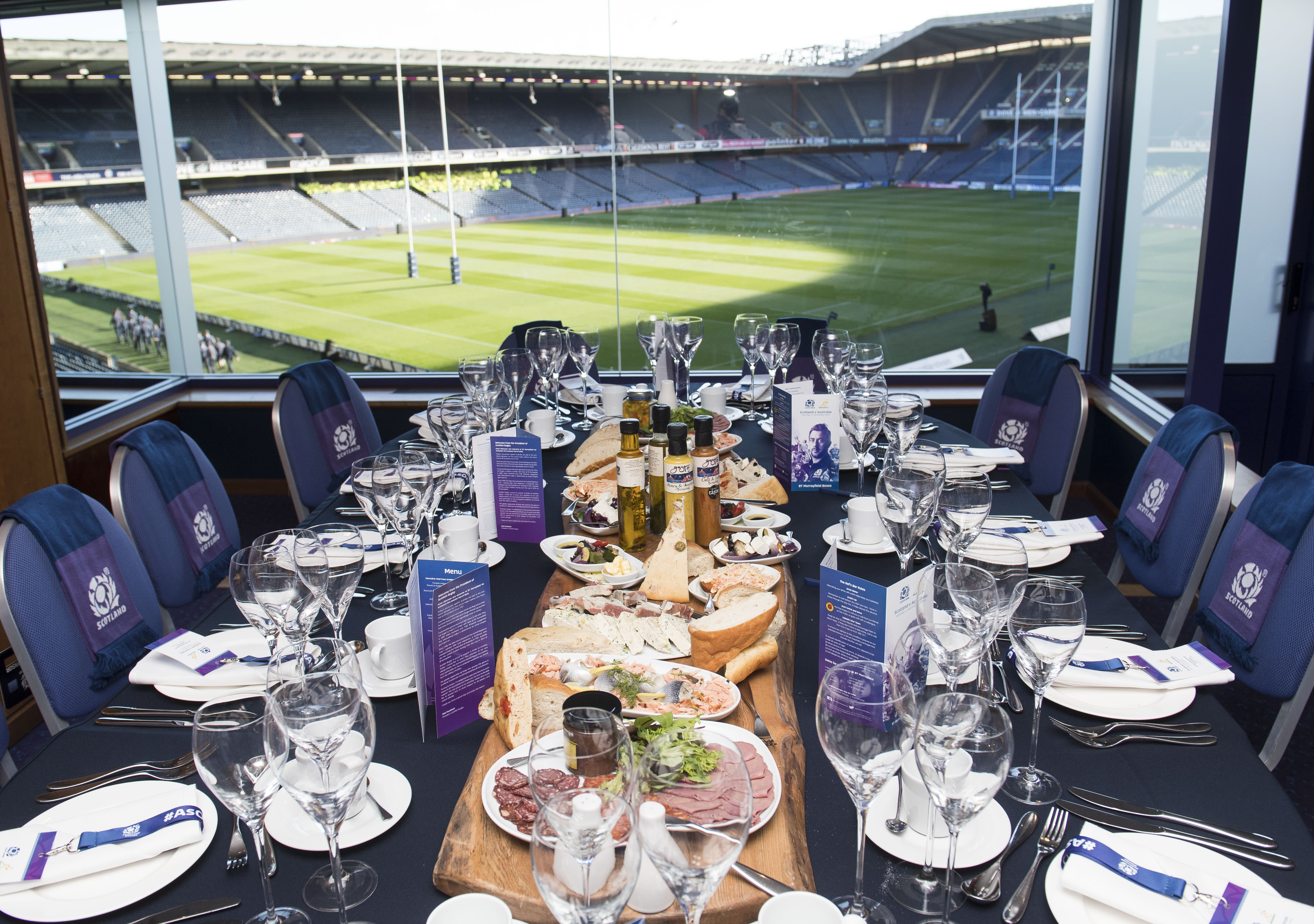 Executive box hospitality table, food spread and pitch views at BT Murrayfield
