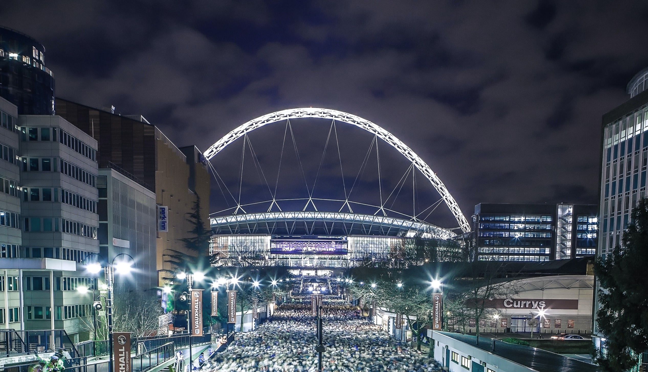 80,000 People leave Wembley Stadium after the match between England and Brazil.You can also see Sirius just above the stadium’s arch