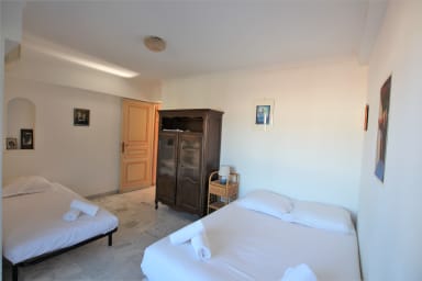 air conditioned bedroom with 1 double bed and 1 single bed