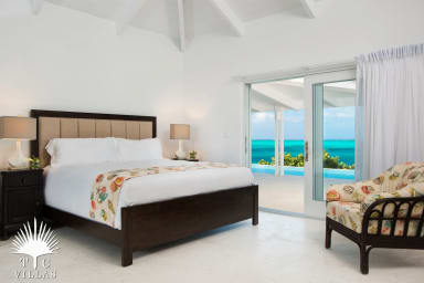 Two equal master suites with en-suite bathrooms open to the pool.