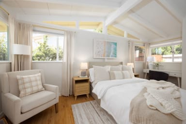 Cozy ground-floor bedroom featuring a comfortable queen bed