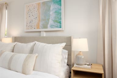 Cozy ground-floor bedroom featuring a comfortable queen bed