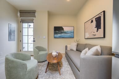 Seating area with sofa and lounge chairs
