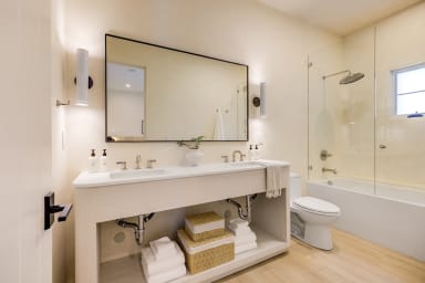En-suite bathroom with rain shower and high-end toiletries