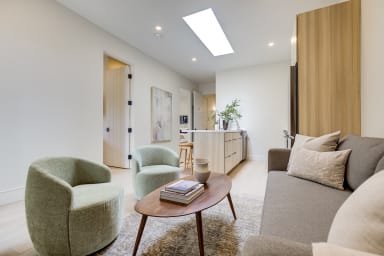 Seating area with sofa and lounge chairs