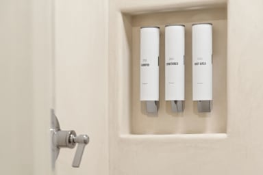 En-suite bathroom with rain shower and high-end toiletries