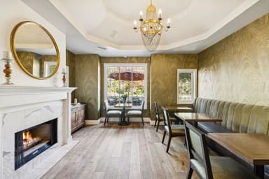 Your cozy spot: A first-floor common area with a fireplace.