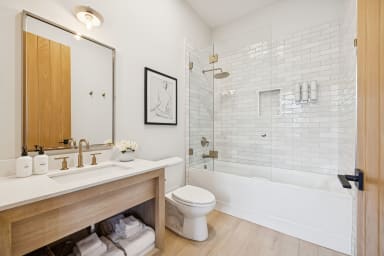 En-suite bathroom with rain shower and high-end toiletries