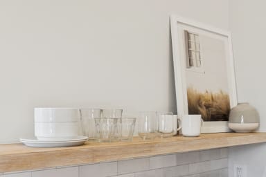 Kitchenette with mini-fridge, sink, and a Nespresso (no stove)