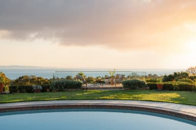Resort-style circular pool as the centerpiece of the backyard
