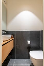 Separate toilet located in the apartment entrance.
