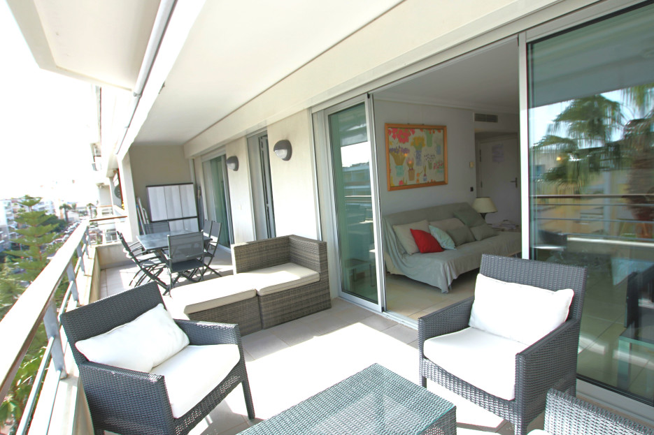large terrace, lounge area and dining table