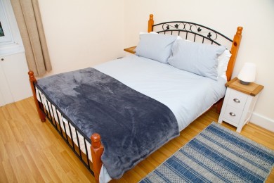 Comfy double bed for a good night's sleep.