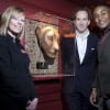 Lion King cast members Stephen Carlile (Scar) and Cleveland Cathnott (Mufasa) and Stacey Broadmeadow, theatre manager, unveil the Lioness mask on display in the Palace Theatre foyer