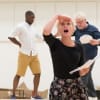 Dwane Walcott, Rose Reynolds and Ian Redford (Pangloss) in rehearsal for Candide