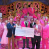 The cast of Cinderella presenting a cheque to the We Love Lichfield fund