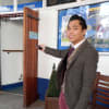 YAT Box Office staff member Dexter Galang operating remote-controlled access door