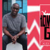 Alex Wheatle with the cover of his book Home Girl