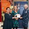 TT&OH Project Administrator Rachel Snape and volunteer Charmian Marshall receive the Heritage Heroes Award from Dr Ingrid Samuel OBE, Acting Chair of Heritage Alliance