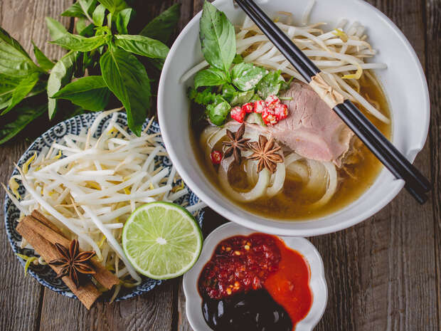 Busy Vietnamese cafe restaurant on busy dining street in Bayswater