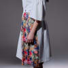 Ruffled white dress with cut-out sleeves and a removable kilt skirt