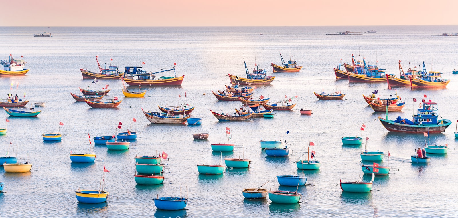 Colorful fishing boat float on the sea at town port in Mui Ne, Vietnam