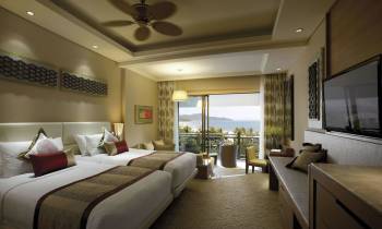 a bedroom with a large bed in a hotel room