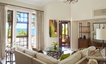 a living room filled with furniture and a large window