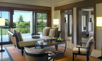 a living room filled with furniture and a large window