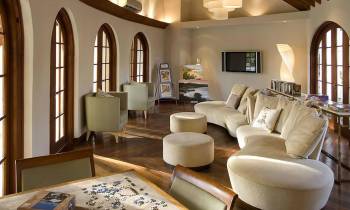 a living room filled with furniture and a large window