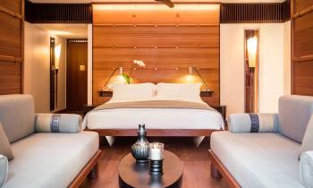 a bedroom with a bed and a mirror