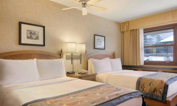 a bedroom with a large bed in a hotel room