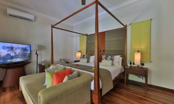 a bedroom with a view of a living room