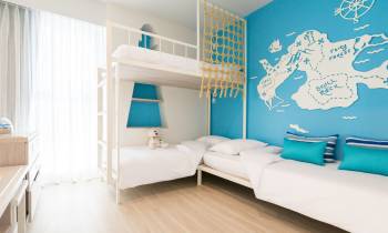 a bedroom with a bed in a room