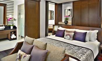a living room filled with furniture and a flat screen tv