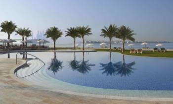 a pool next to a body of water