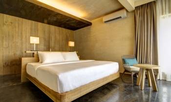 a bedroom with a wooden floor