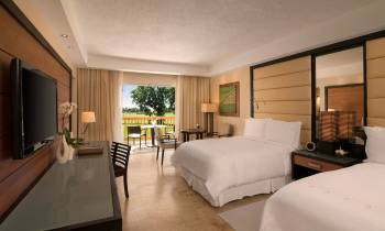 a bedroom with a large bed in a room