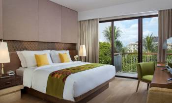 a bedroom with a large bed in a hotel room