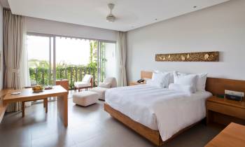 a bedroom with a large bed in a room