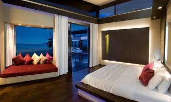 a large white bed in a hotel room