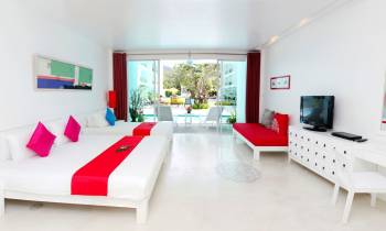 a living room with a red and white furniture