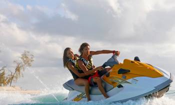 a person riding a surf board on a body of water
