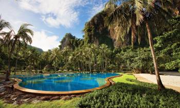 a pool next to a body of water