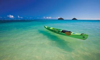 a person riding a surf board on a body of water