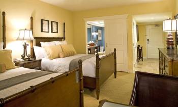 a bedroom with a large bed in a room