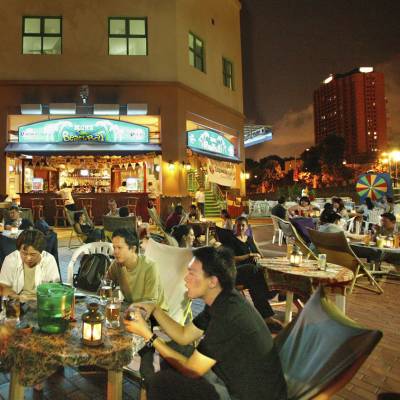 a group of people sitting at a table in a restaurant