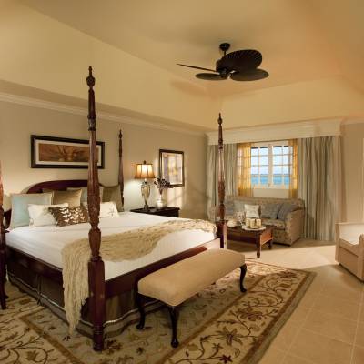 a bedroom with a large bed in a room